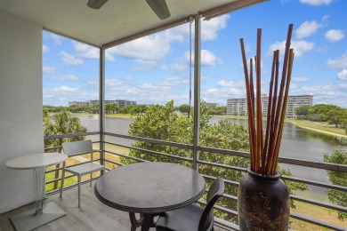 Wake up to sparkling lake views in this bright 1BR/1.5BA Palm on Palm-Aire Country Club and Resort - The Oaks in Florida - for sale on GolfHomes.com, golf home, golf lot