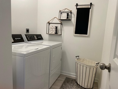 This new townhome blends modern design with everyday convenience on Alwyn Downs Golf Club in Michigan - for sale on GolfHomes.com, golf home, golf lot