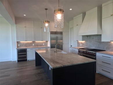 The Residences are luxury new construction golf villas nestled on TPC Four Seasons Las Colinas in Texas - for sale on GolfHomes.com, golf home, golf lot