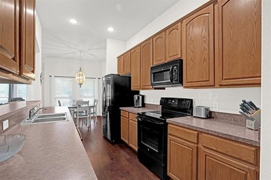 Charming cottage-style home in the desirable Winsor Meadows at on WestRidge Golf Course in Texas - for sale on GolfHomes.com, golf home, golf lot