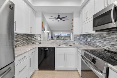 Stunning 2/2 plus den, second floor- corner condo with 1,598sq on Boca Delray Golf and Country Club in Florida - for sale on GolfHomes.com, golf home, golf lot