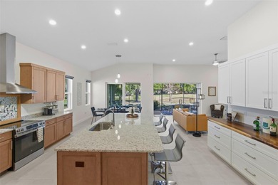 Welcome Home to luxury living in the double-gated Bella Vista on Harbor Hills Country Club in Florida - for sale on GolfHomes.com, golf home, golf lot