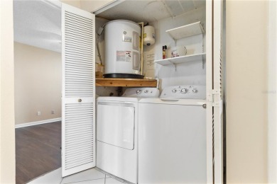 GROUND FLOOR, CORNER UNIT WITH UNOBSTRUCTED GOLF COURSE VIEWS on Feather Sound Country Club in Florida - for sale on GolfHomes.com, golf home, golf lot