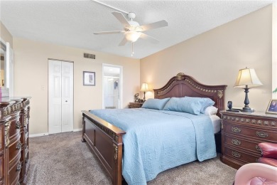 GROUND FLOOR, CORNER UNIT WITH UNOBSTRUCTED GOLF COURSE VIEWS on Feather Sound Country Club in Florida - for sale on GolfHomes.com, golf home, golf lot