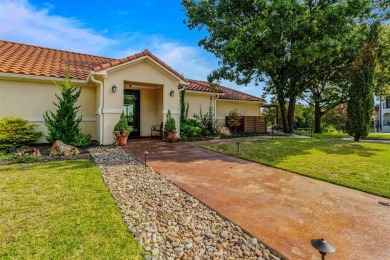 Resting in a gated neighborhood in Rockwall right off Lake Ray on Lakeside Village Golf Course in Texas - for sale on GolfHomes.com, golf home, golf lot