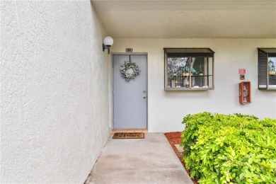 GROUND FLOOR, CORNER UNIT WITH UNOBSTRUCTED GOLF COURSE VIEWS on Feather Sound Country Club in Florida - for sale on GolfHomes.com, golf home, golf lot