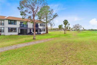 GROUND FLOOR, CORNER UNIT WITH UNOBSTRUCTED GOLF COURSE VIEWS on Feather Sound Country Club in Florida - for sale on GolfHomes.com, golf home, golf lot