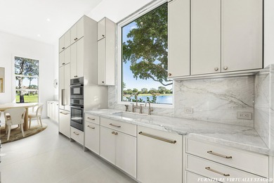 Move right into this never-lived-in, reimagined 3-bedroom, 3 on St. Andrews Country Club of Boca Raton in Florida - for sale on GolfHomes.com, golf home, golf lot