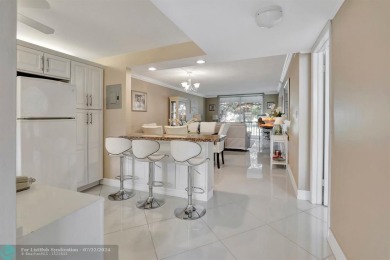 Bright Full Two Bedroom Corner With Water View On Par 3 Golf on Hollybrook Golf and Tennis Club  in Florida - for sale on GolfHomes.com, golf home, golf lot