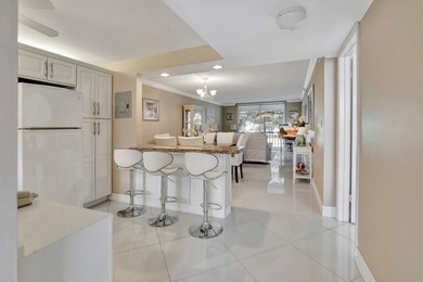 Bright Full Two Bedroom Corner With Water View On Par 3 Golf on Hollybrook Golf and Tennis Club  in Florida - for sale on GolfHomes.com, golf home, golf lot