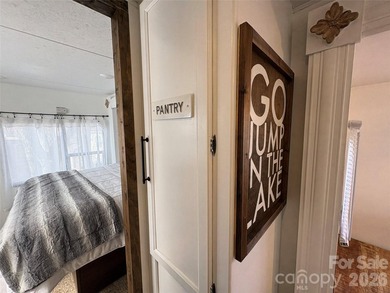 Welcome to easy lake living inside the gated community of Badin on Old North State Club at Uwharrie Point Golf community in North Carolina - for sale on GolfHomes.com, golf home, golf lot