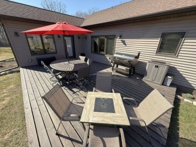 Nestled on a serene treed lot, this stunning one-story on Devils Lake Town and Country Club in North Dakota - for sale on GolfHomes.com, golf home, golf lot
