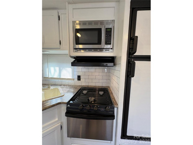 Welcome to easy lake living inside the gated community of Badin on Old North State Club at Uwharrie Point Golf community in North Carolina - for sale on GolfHomes.com, golf home, golf lot