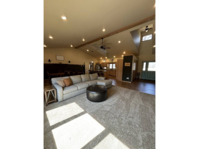 Nestled on a serene treed lot, this stunning one-story on Devils Lake Town and Country Club in North Dakota - for sale on GolfHomes.com, golf home, golf lot