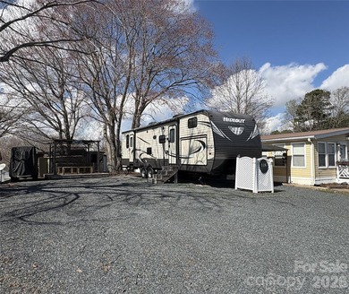 Welcome to easy lake living inside the gated community of Badin on Old North State Club at Uwharrie Point Golf community in North Carolina - for sale on GolfHomes.com, golf home, golf lot