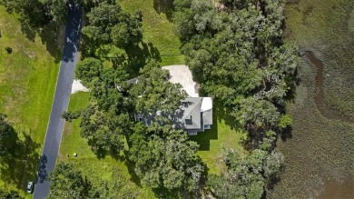 Welcome to your dream home in the picturesque Cooper's Point on Sapelo Hammock Golf Club in Georgia - for sale on GolfHomes.com, golf home, golf lot