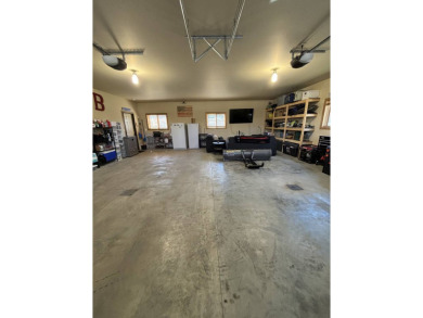 Nestled on a serene treed lot, this stunning one-story on Devils Lake Town and Country Club in North Dakota - for sale on GolfHomes.com, golf home, golf lot
