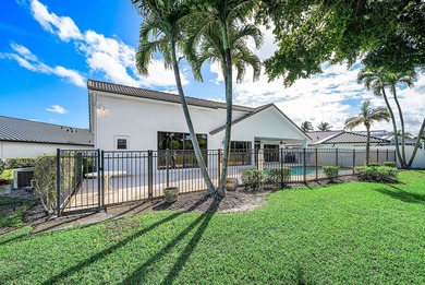 Nestled on a quiet cul-de-sac in the desirable Boca Woods on Boca Woods Country Club in Florida - for sale on GolfHomes.com, golf home, golf lot