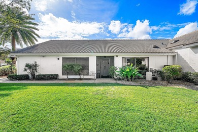 Nestled on a quiet cul-de-sac in the desirable Boca Woods on Boca Woods Country Club in Florida - for sale on GolfHomes.com, golf home, golf lot