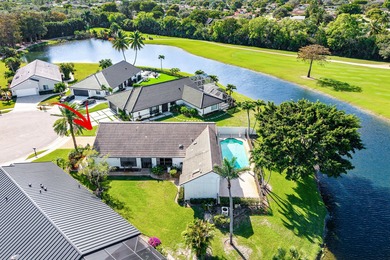 Nestled on a quiet cul-de-sac in the desirable Boca Woods on Boca Woods Country Club in Florida - for sale on GolfHomes.com, golf home, golf lot