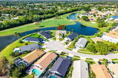 Nestled on a quiet cul-de-sac in the desirable Boca Woods on Boca Woods Country Club in Florida - for sale on GolfHomes.com, golf home, golf lot