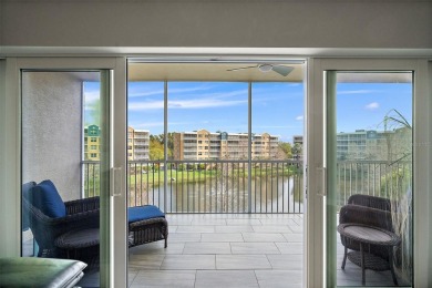 Indulge in contemporary luxury at this stunning 3rd-floor condo on East Bay Golf Club in Florida - for sale on GolfHomes.com, golf home, golf lot