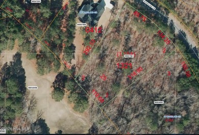 Build your dream home on this beautiful 1.15-acre wooded lot on Foxfire Golf and Country Club in North Carolina - for sale on GolfHomes.com, golf home, golf lot
