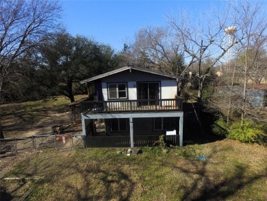 If you are looking for a lake home with character you won't want on Tawakoni Golf Course in Texas - for sale on GolfHomes.com, golf home, golf lot