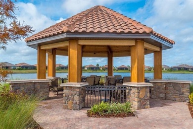 This beautifully updated second-floor home in Esplanade Lakewood on Esplanade Golf and Country at Lakewood Ranch in Florida - for sale on GolfHomes.com, golf home, golf lot