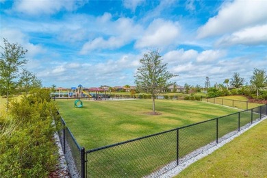 This beautifully updated second-floor home in Esplanade Lakewood on Esplanade Golf and Country at Lakewood Ranch in Florida - for sale on GolfHomes.com, golf home, golf lot