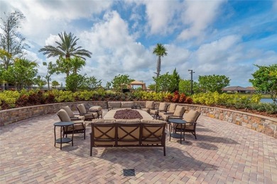This beautifully updated second-floor home in Esplanade Lakewood on Esplanade Golf and Country at Lakewood Ranch in Florida - for sale on GolfHomes.com, golf home, golf lot