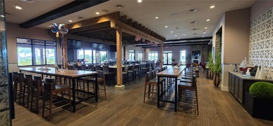 This beautifully updated second-floor home in Esplanade Lakewood on Esplanade Golf and Country at Lakewood Ranch in Florida - for sale on GolfHomes.com, golf home, golf lot