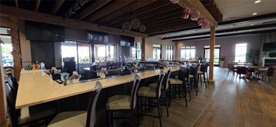 This beautifully updated second-floor home in Esplanade Lakewood on Esplanade Golf and Country at Lakewood Ranch in Florida - for sale on GolfHomes.com, golf home, golf lot