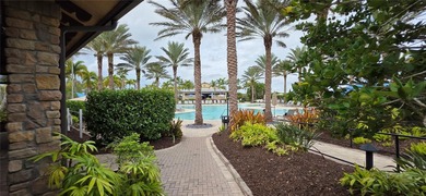 This beautifully updated second-floor home in Esplanade Lakewood on Esplanade Golf and Country at Lakewood Ranch in Florida - for sale on GolfHomes.com, golf home, golf lot