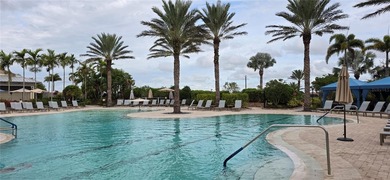 This beautifully updated second-floor home in Esplanade Lakewood on Esplanade Golf and Country at Lakewood Ranch in Florida - for sale on GolfHomes.com, golf home, golf lot