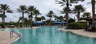 This beautifully updated second-floor home in Esplanade Lakewood on Esplanade Golf and Country at Lakewood Ranch in Florida - for sale on GolfHomes.com, golf home, golf lot