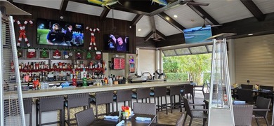 This beautifully updated second-floor home in Esplanade Lakewood on Esplanade Golf and Country at Lakewood Ranch in Florida - for sale on GolfHomes.com, golf home, golf lot