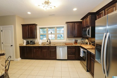Welcome home to this beautifully cared-for property in the White on Pine Hill Country Club in Alabama - for sale on GolfHomes.com, golf home, golf lot