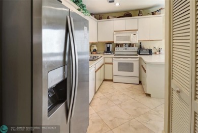 Not to be missed bright and airy upstairs 2-bedroom 2 bath unit on Fountains Golf and Country Club in Florida - for sale on GolfHomes.com, golf home, golf lot