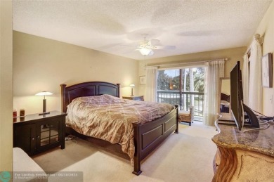 Not to be missed bright and airy upstairs 2-bedroom 2 bath unit on Fountains Golf and Country Club in Florida - for sale on GolfHomes.com, golf home, golf lot