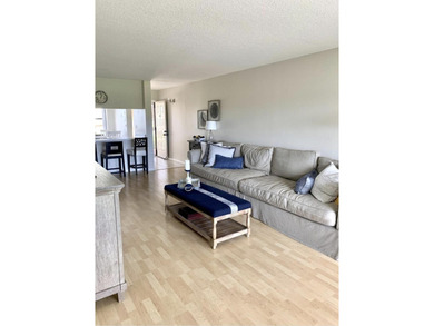 Beautifully updated second floor condo offers sweeping golf on Old Marsh Golf Club in Florida - for sale on GolfHomes.com, golf home, golf lot