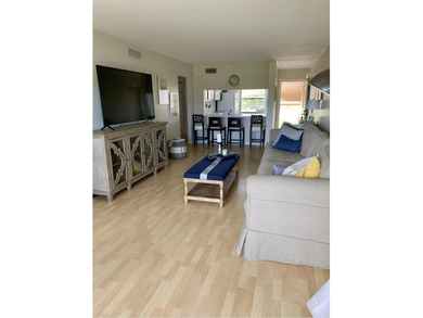 Beautifully updated second floor condo offers sweeping golf on Old Marsh Golf Club in Florida - for sale on GolfHomes.com, golf home, golf lot