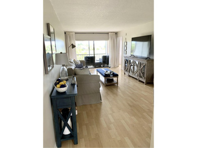 Beautifully updated second floor condo offers sweeping golf on Old Marsh Golf Club in Florida - for sale on GolfHomes.com, golf home, golf lot