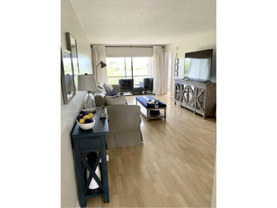 Beautifully updated second floor condo offers sweeping golf on Old Marsh Golf Club in Florida - for sale on GolfHomes.com, golf home, golf lot