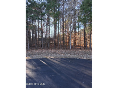 Beautiful wooded over half acre mostly level homesite at the on Sound Golf Links at Albemarle Plantation in North Carolina - for sale on GolfHomes.com, golf home, golf lot