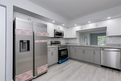 Updated 2 bedroom, 2 bath condo in Century Village in excellent on Flamingo Lakes Country Club in Florida - for sale on GolfHomes.com, golf home, golf lot