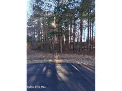 Beautiful wooded over half acre mostly level homesite at the on Sound Golf Links at Albemarle Plantation in North Carolina - for sale on GolfHomes.com, golf home, golf lot