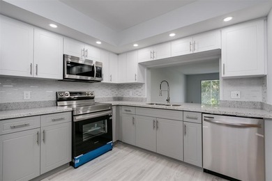 Updated 2 bedroom, 2 bath condo in Century Village in excellent on Flamingo Lakes Country Club in Florida - for sale on GolfHomes.com, golf home, golf lot