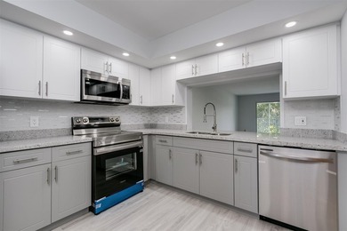 Updated 2 bedroom, 2 bath condo in Century Village in excellent on Flamingo Lakes Country Club in Florida - for sale on GolfHomes.com, golf home, golf lot