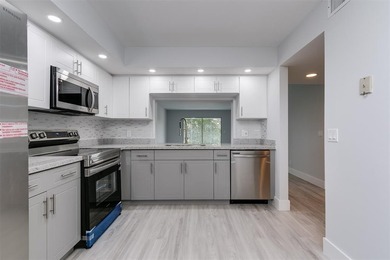 Updated 2 bedroom, 2 bath condo in Century Village in excellent on Flamingo Lakes Country Club in Florida - for sale on GolfHomes.com, golf home, golf lot